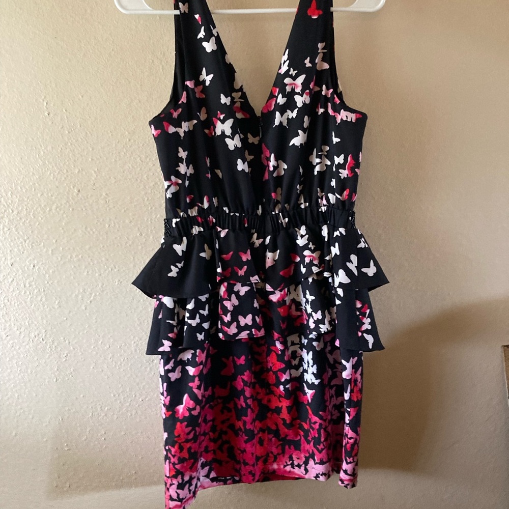 Cute Bebe dress size medium with butterflies print